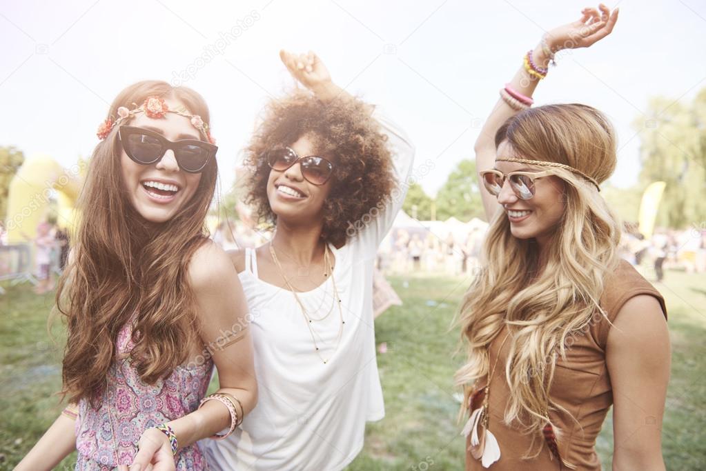 Three best friends at the music festival