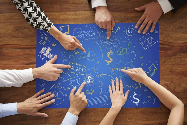 Human hands pointing on the blue paper — Stock Photo, Image