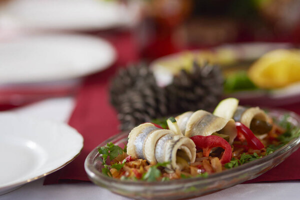 Herring rolls on Christmas table