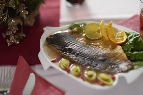 Delicious carp decorated with vegetables and citrus — Stock Image Delicious carp decorated with vegetables and citrus Royalty Free Stock Images