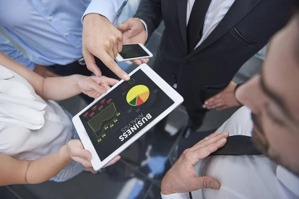 Business people browsing a digital tablet — Stock Photo, Image