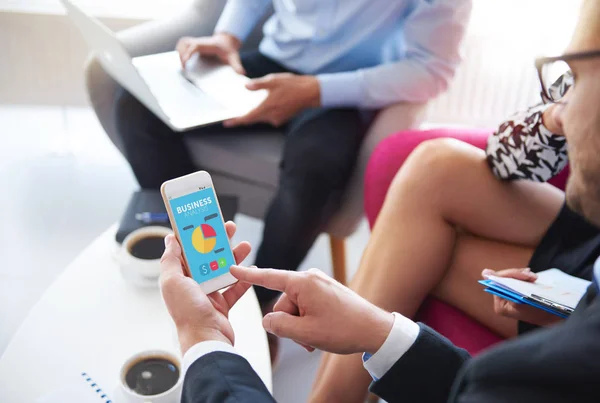 Mobilephone used during the business meeting — Stock Photo, Image