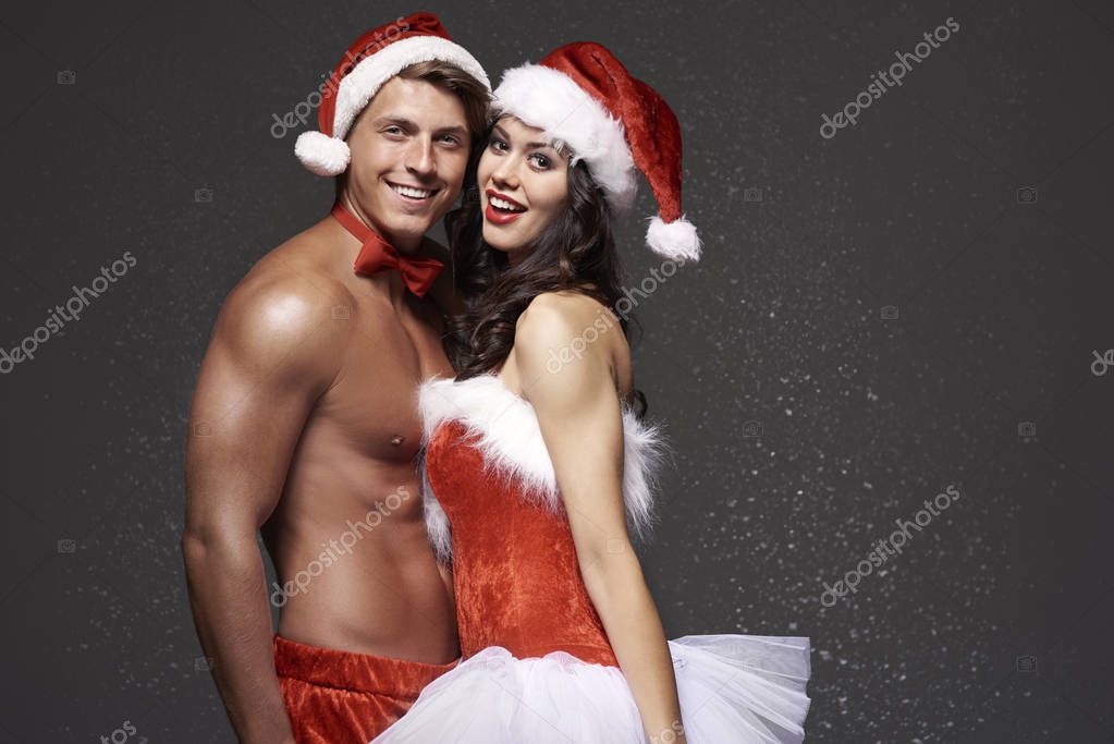 Christmas couple in red underwear Stock Photo by ©gpointstudio 129649308