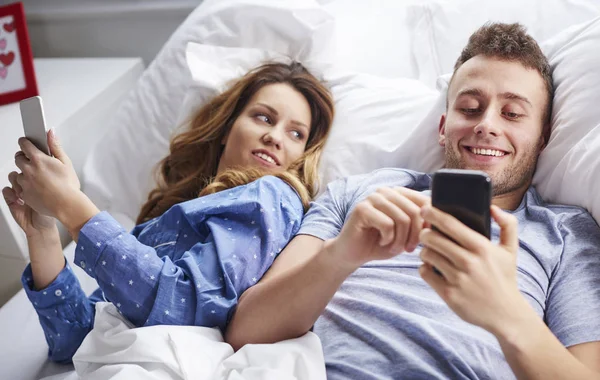 Beautiful couple in pajamas — Stock Photo, Image