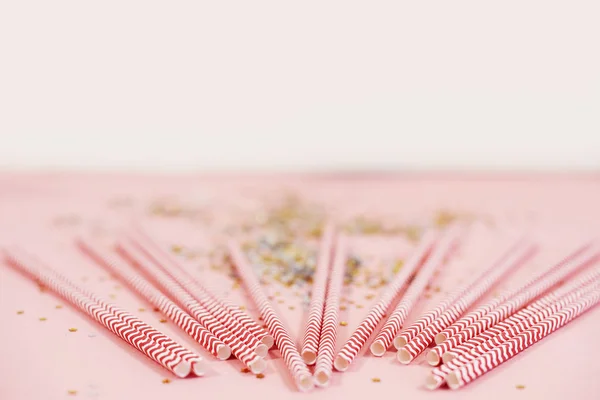 Red straws and confetti — Stock Photo, Image