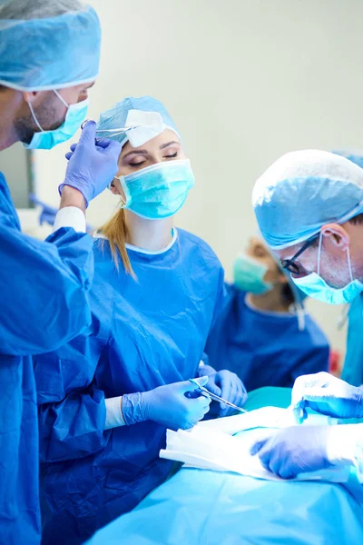 Tired surgeon during operation — Stock Photo, Image