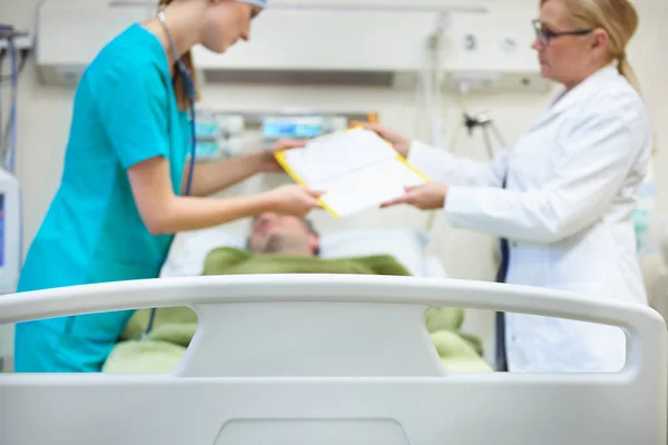 Bed with patient in recovery room — Stock Photo, Image