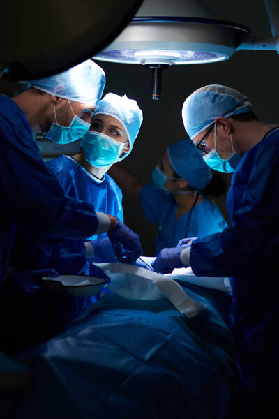 Surgeons during operation