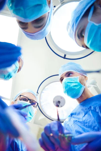 Surgeons over operating table — Stock Photo, Image