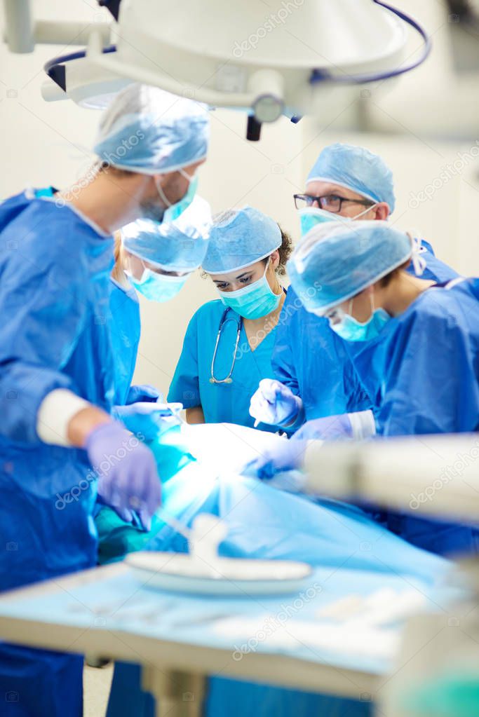 Surgeons during operation
