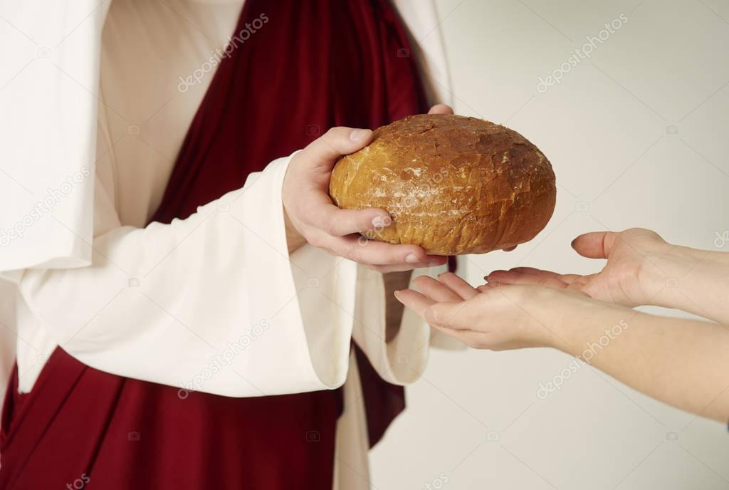 Jesus holding bread 