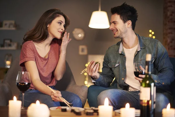 Couple enjoying Asian food — Stock Photo, Image