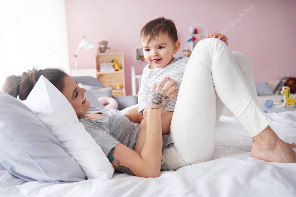 Young mom playing with baby