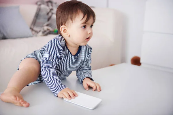 Baby playing with smartphone — Stock Photo, Image