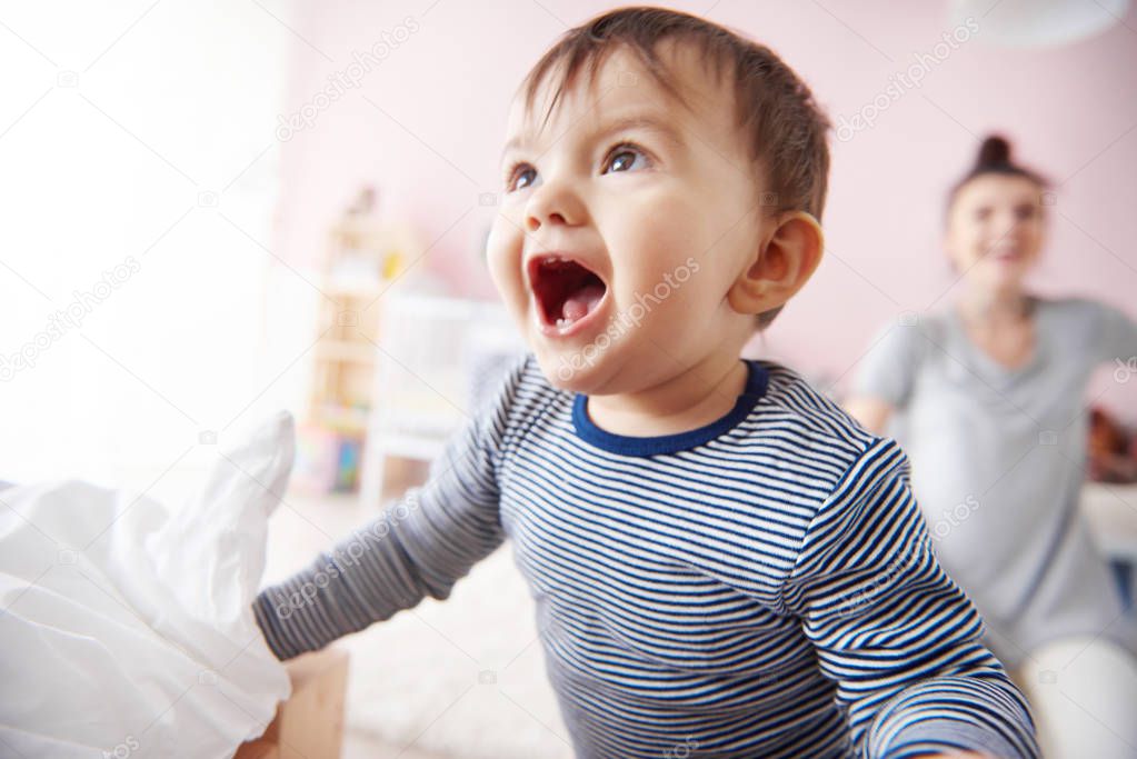 Young mom playing with baby