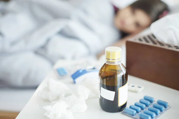 Pills and syrup on table — Stock Photo, Image