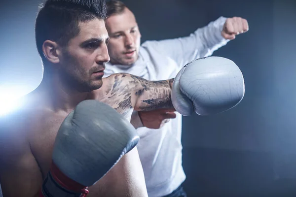 Male boxer training with his coach — Stock Photo, Image