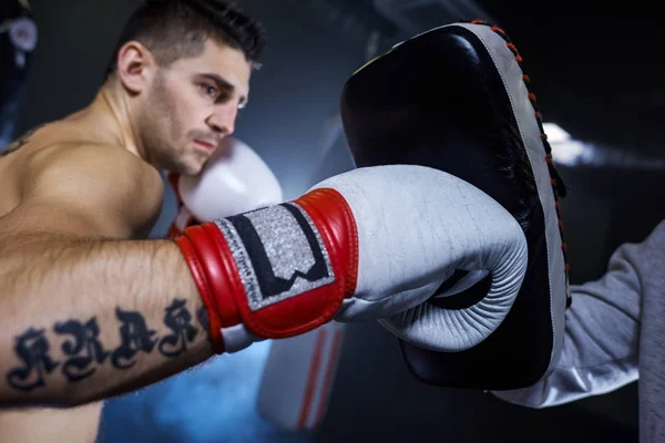 Male boxer training with his coach — Stock Photo, Image