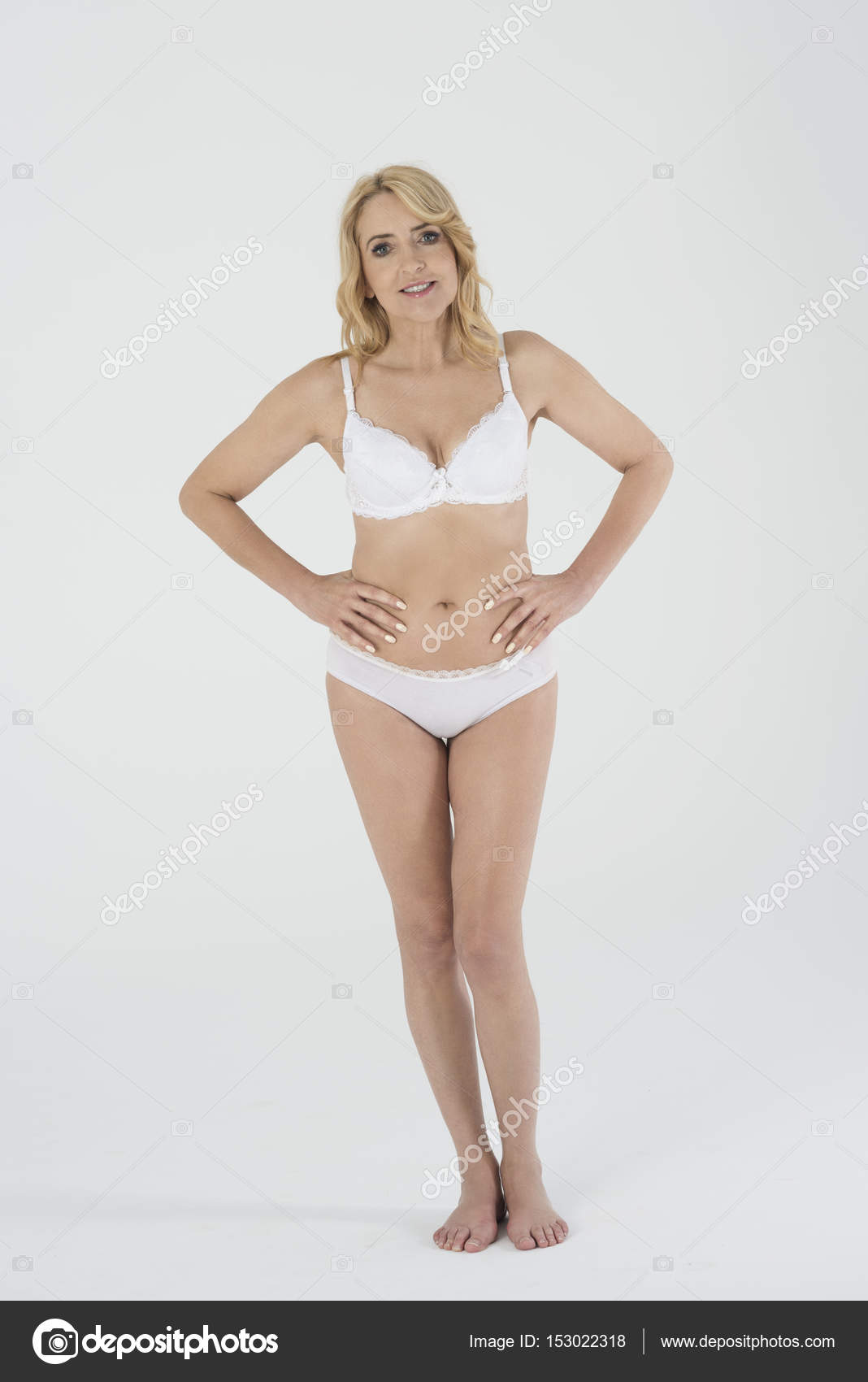 Mature woman in lingerie Stock Photo by gpointstudio 153022318