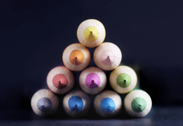 Colored pencils in triangular shape — Stock Photo, Image