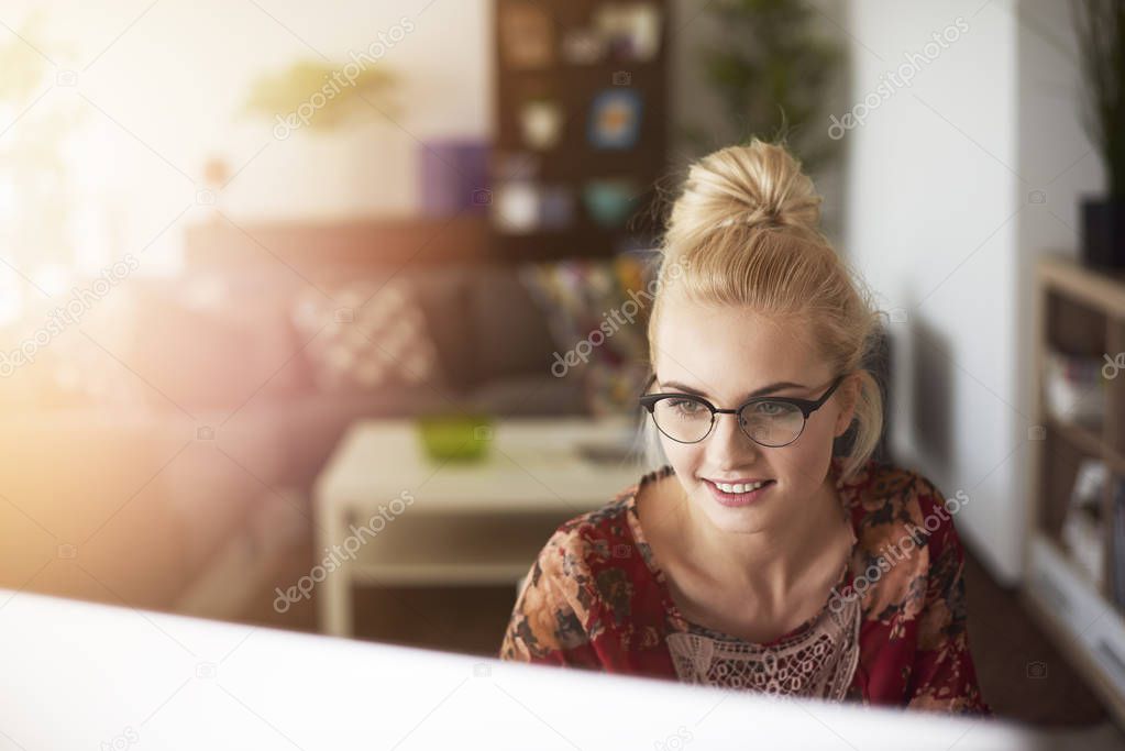 woman behind the computer screen
