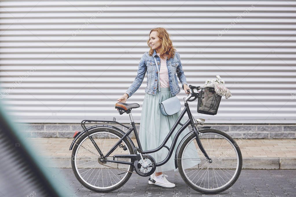 Fashionable woman with bike