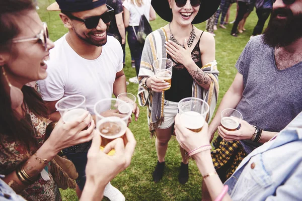 Group of friends drinking a beer at the festival Stock Image