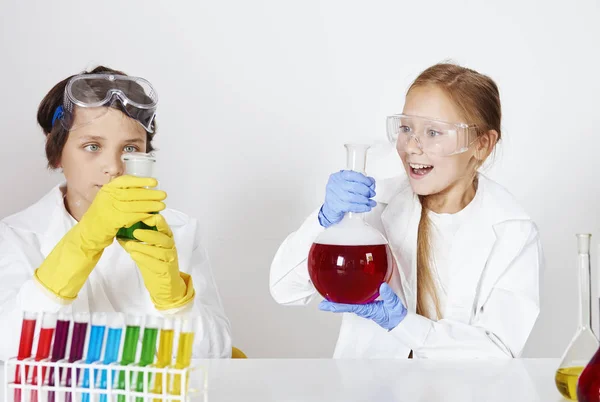 Kids making a experiment Royalty Free Stock Images