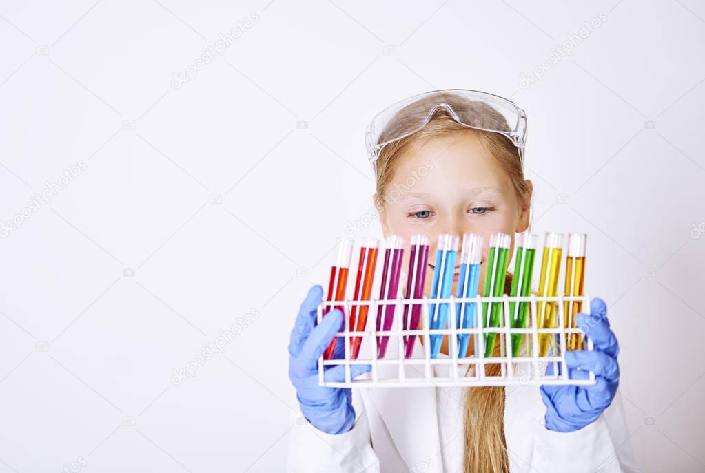 girl holding laboratory glassware