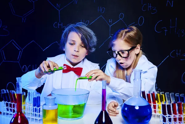 Kids making chemical experiment Stock Picture