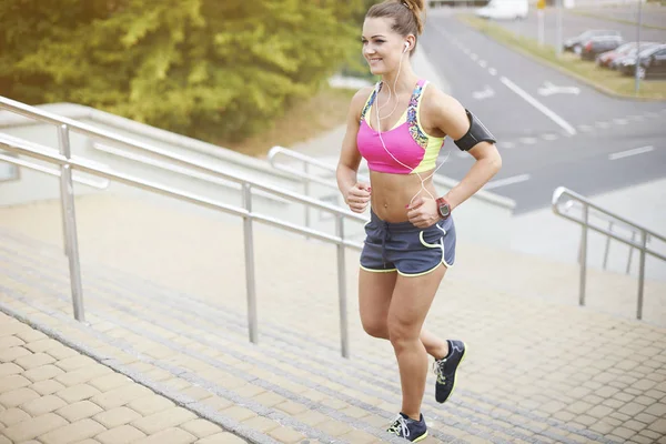 woman running up the stairs