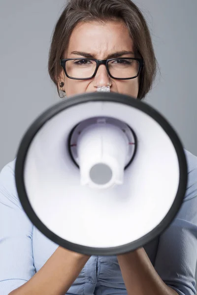 Businesswoman screaming in loudspeaker — Stock Photo, Image