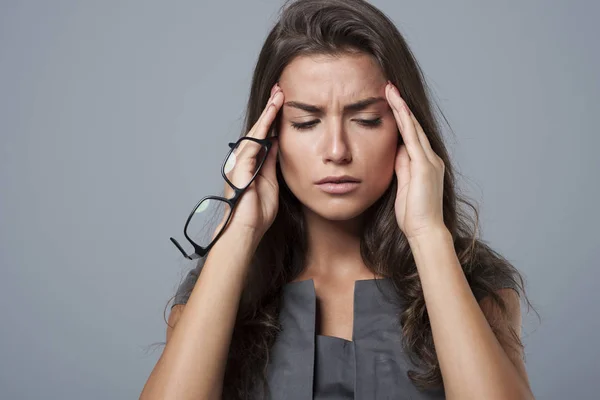 Businesswoman having headache — Stock Photo, Image