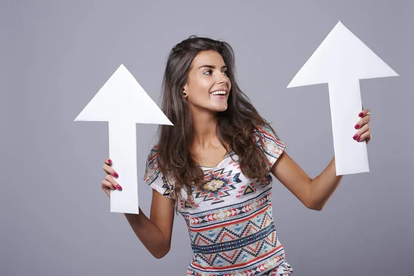 woman holding paper arrows