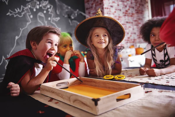 Happy children in halloween costumes — Stock Photo, Image