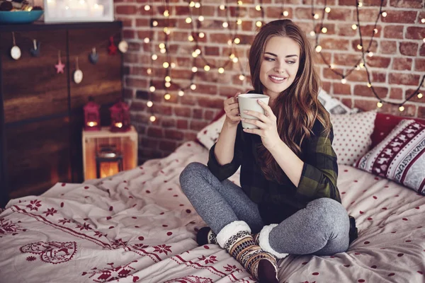 Woman with coffee in bedroom — Stock Photo, Image