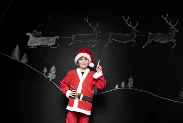Niño disfrazado de Papá Noel —  Fotos de Stock