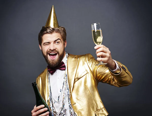 Man with birthday hat toasting — Stock Photo, Image
