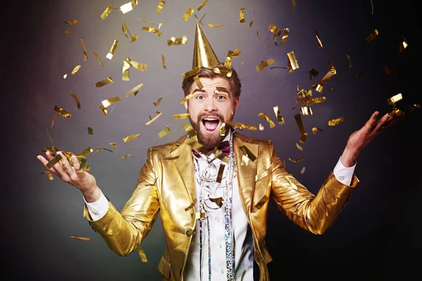 Portrait of man among confetti — Stock Photo, Image