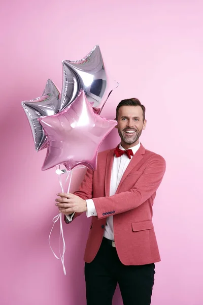 Portrait of man holding star shape balloon — Stock Photo, Image