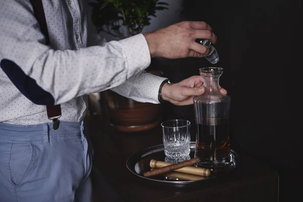 Business person drinking whiskey at his office