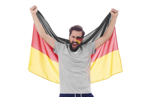 Schreiender Mann schwenkt Nationalflagge und jubelt — Stockfoto