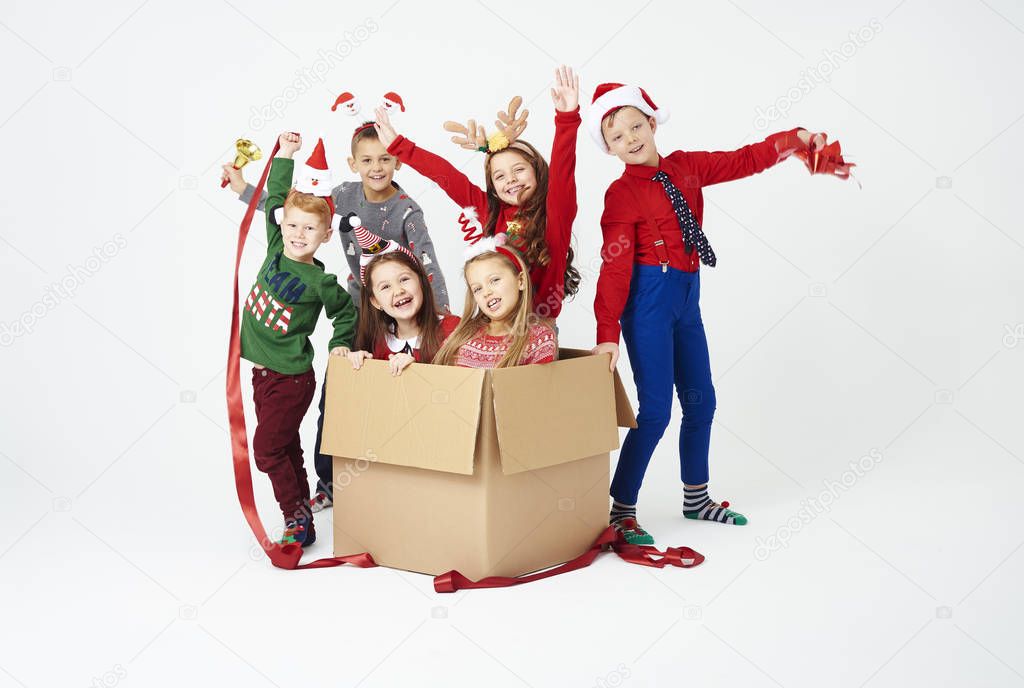 Portrait of children and open gift box