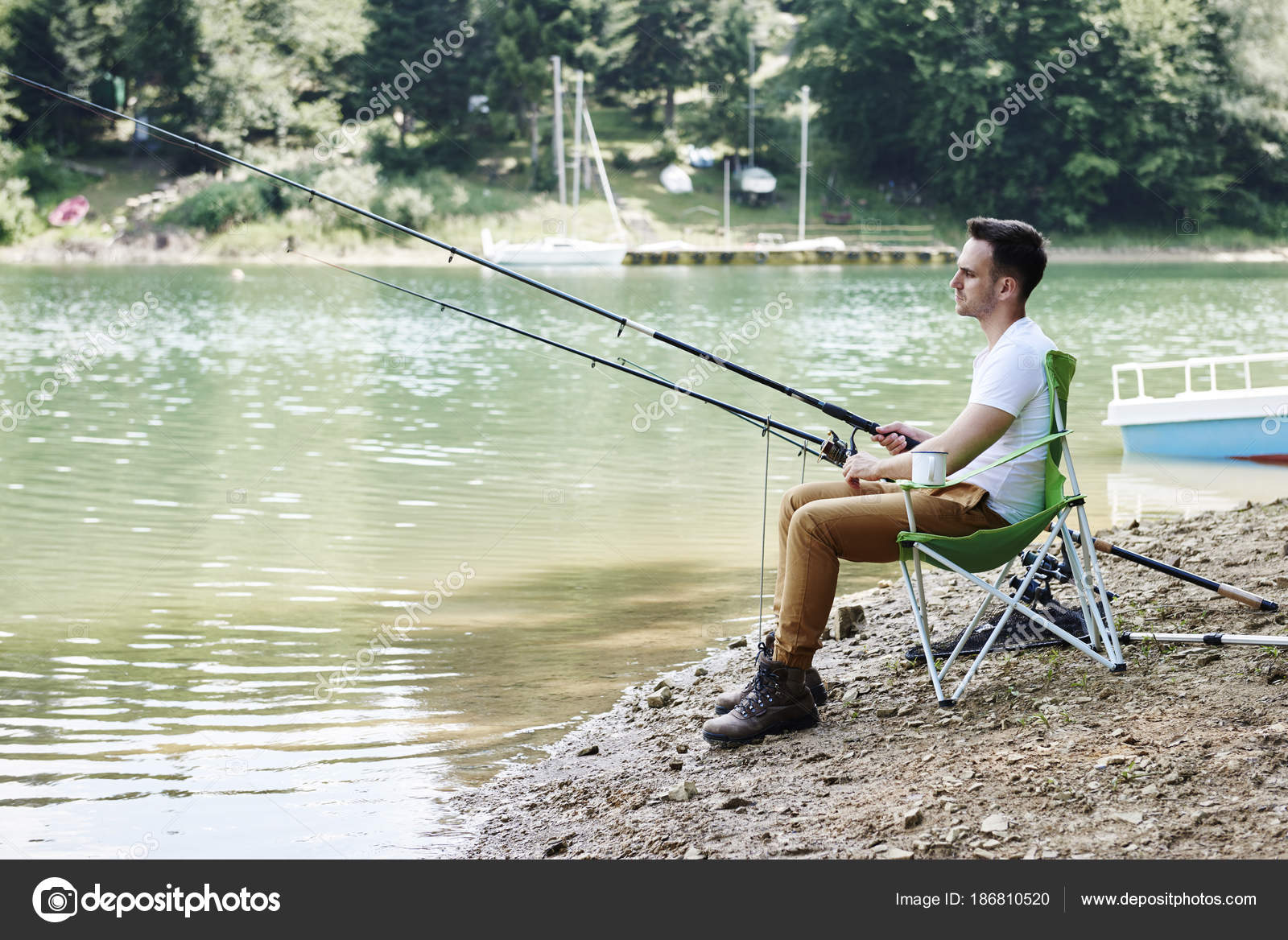 Men Fishing Rod Sitting Fishing Chair Stock Photo by ©gpointstudio 186810520