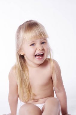Naked child laughing at studio shot  clipart