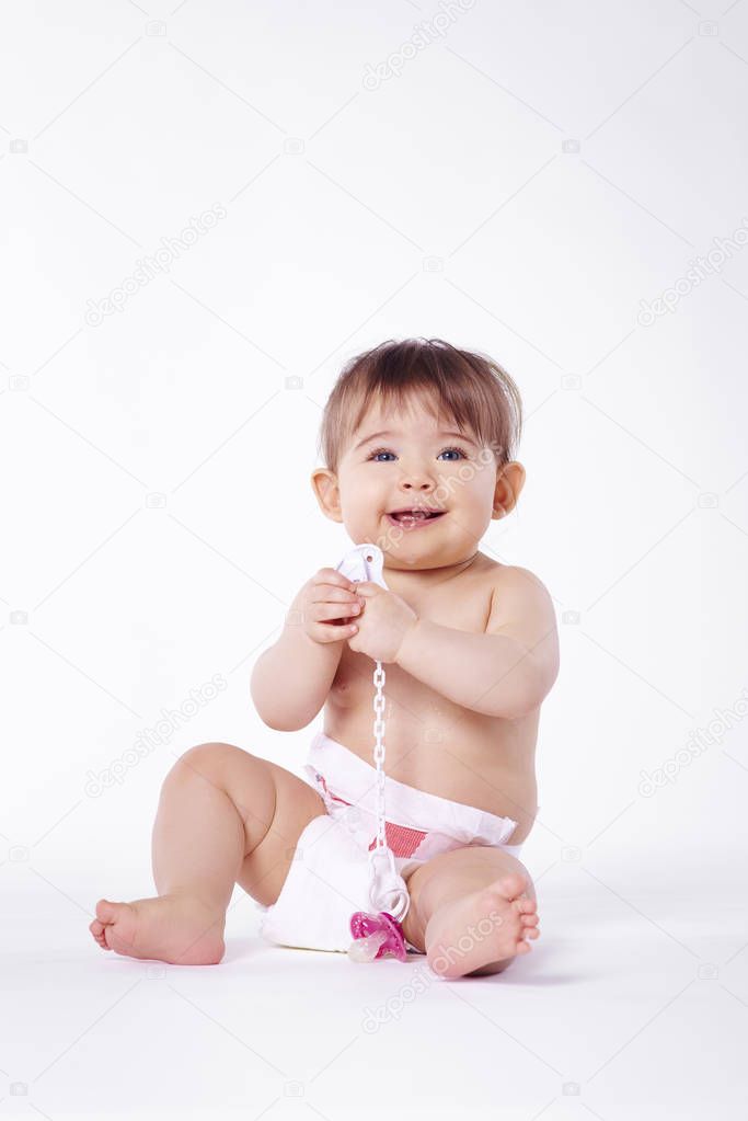 Portrait of cheerful baby in diaper
