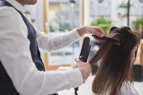 Female Hairdresser Using Comb Straightener — 스톡 사진
