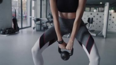 Handheld view of woman during hard workout at gym.  Shot with RED helium camera in 8K