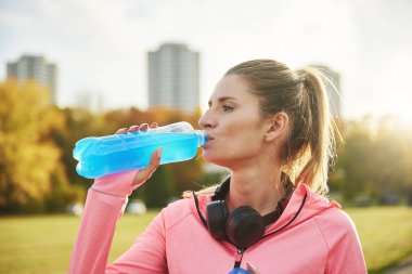 Woman taking a sip of refreshing water
