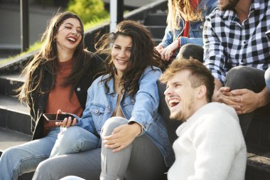 Young people having great time together in the city 